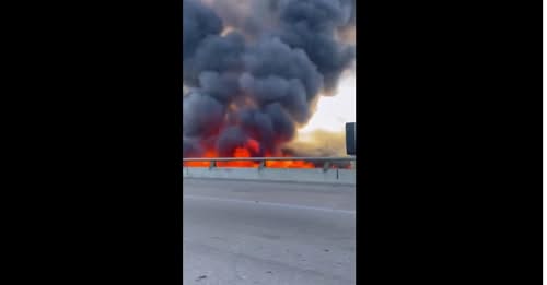 East 30th Street Fire Emergency : Large Multi-Structure Blaze Erupts on East 30th Street: Firefighters Battle Intense Flames as Multiple Buildings are Engulfed in Fire